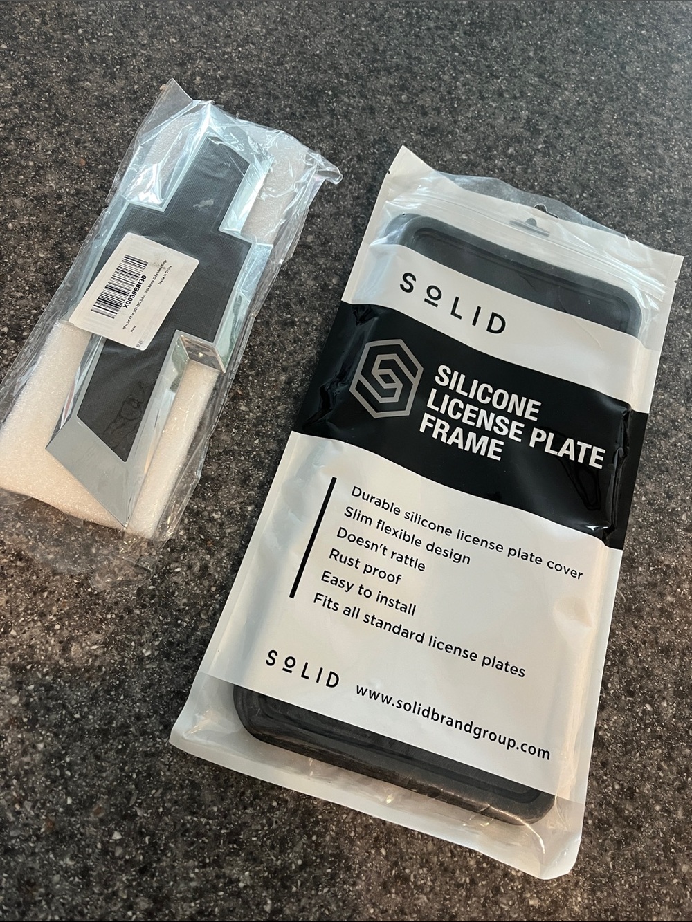 NWT black Chevy emblems & 2 black silicone license plate frames